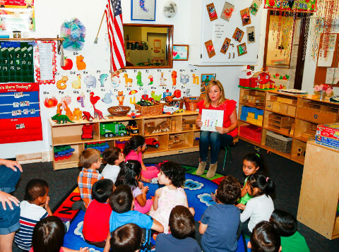 About Us - Jessica Capshaw reading to classroom